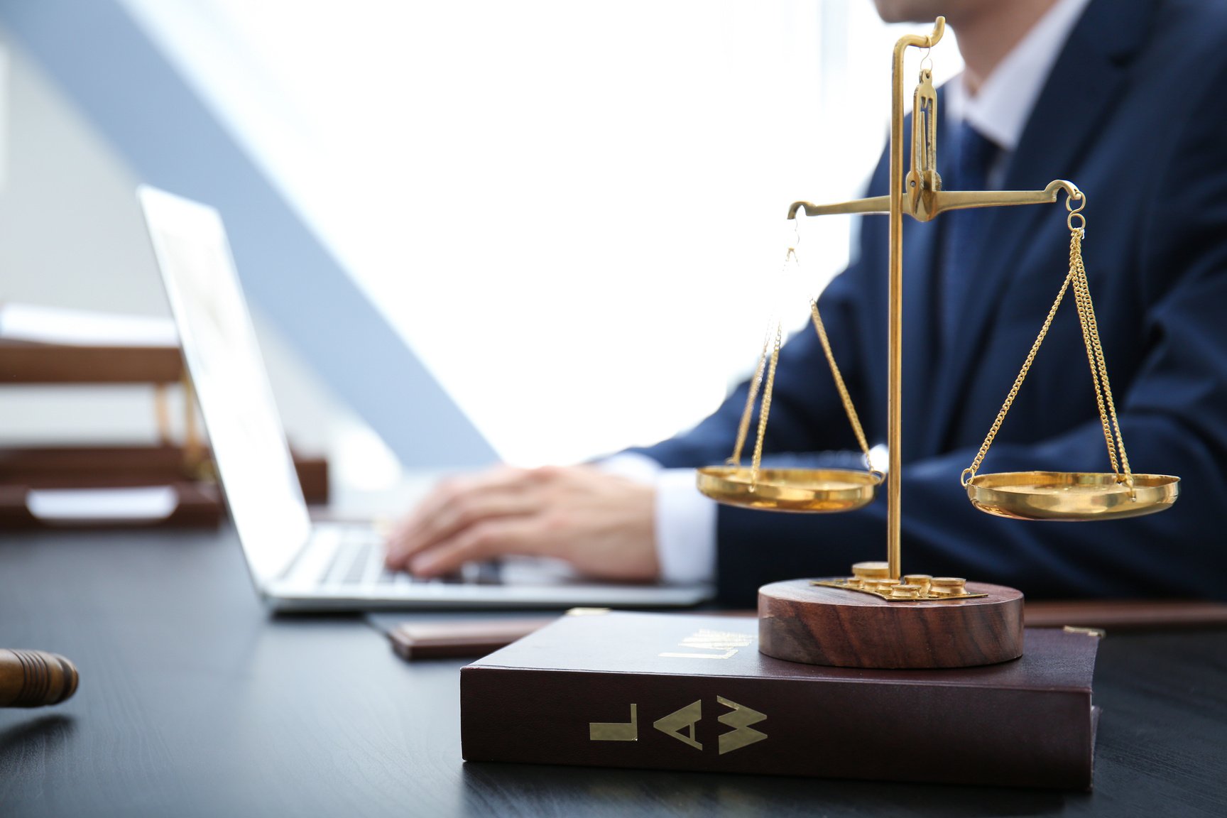 Scales of Justice and Juridical Book on Lawyer's Office Table