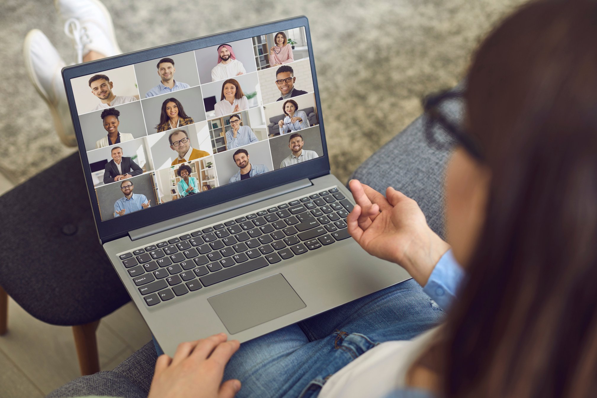 Woman Having a Virtual Meeting with Her Business Colleagues on Her Laptop Computer