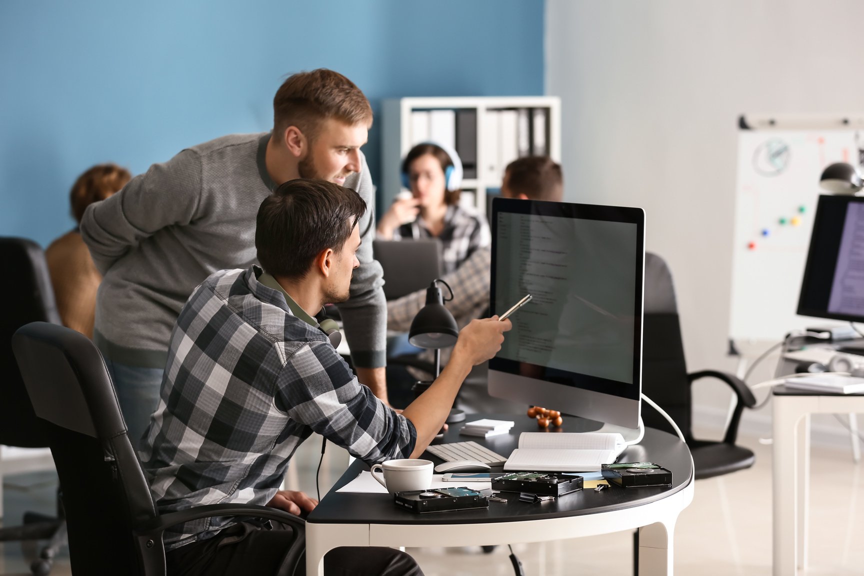 IT Specialists Working in Office